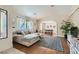 Inviting living room with a large sectional sofa, decorative rug, and stylish accents creating a warm and welcoming space at 7385 Severence Ln, Las Vegas, NV 89131