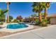 Inviting backyard pool with surrounding palm trees, and comfortable lounge seating at 7385 Severence Ln, Las Vegas, NV 89131