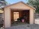 Interior of shed featuring storage shelves, gardening tools, and ample space at 7385 Severence Ln, Las Vegas, NV 89131