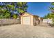 Large backyard with gravel, block wall, and a storage shed for tools and equipment at 7385 Severence Ln, Las Vegas, NV 89131
