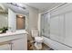 Well-lit bathroom featuring a shower over tub, a vanity with a sink, and modern fixtures at 744 Mcknight St, Las Vegas, NV 89101