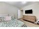 Comfortable bedroom with bright floral bedding and wood-look flooring at 744 Mcknight St, Las Vegas, NV 89101