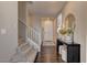Inviting entryway with hardwood floors, staircase, and elegant decor at 7705 Alder Forest St, Las Vegas, NV 89113