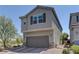Charming two-story home featuring a two-car garage and brick-paved driveway at 7705 Alder Forest St, Las Vegas, NV 89113