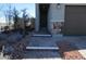 The beautiful entryway shows an attractive walkway, landscaping, and stone accents at 7705 Alder Forest St, Las Vegas, NV 89113