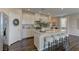 Modern kitchen featuring an island with bar seating, stainless steel appliances and granite countertops at 7705 Alder Forest St, Las Vegas, NV 89113