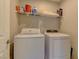 Clean laundry room with white washer and dryer at 7705 Alder Forest St, Las Vegas, NV 89113