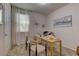 Office space features a desk, neutral carpet, a window with natural light, and stylish decor at 7705 Alder Forest St, Las Vegas, NV 89113