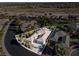 Aerial of landscaped property highlighting its architectural features, pool, and well-manicured yard at 8623 Kennedy Heights Ct, Las Vegas, NV 89131