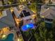 Stunning aerial view of the property featuring a sparkling pool, solar panels and manicured landscaping at 8623 Kennedy Heights Ct, Las Vegas, NV 89131