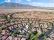 Expansive aerial view highlighting the serene community and the majestic mountains in the distance at 8623 Kennedy Heights Ct, Las Vegas, NV 89131