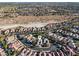 Expansive aerial shot showcasing a residential neighborhood with well-maintained homes and lush landscaping at 8623 Kennedy Heights Ct, Las Vegas, NV 89131