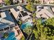 Aerial view of a home featuring a backyard pool, solar panels, landscaping, and an outdoor patio area at 8623 Kennedy Heights Ct, Las Vegas, NV 89131