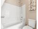 The bathroom includes a shower over tub and a tiled wall with organized towels at 8623 Kennedy Heights Ct, Las Vegas, NV 89131