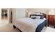 Bedroom featuring plush carpet, a window, full-sized bed, closet and access to the hallway at 8623 Kennedy Heights Ct, Las Vegas, NV 89131