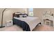 Charming bedroom featuring plush carpet, window, full-sized bed and vanity at 8623 Kennedy Heights Ct, Las Vegas, NV 89131