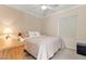 Neutral colored bedroom featuring carpet floors, ceiling fan, and a window at 8623 Kennedy Heights Ct, Las Vegas, NV 89131