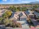 Beautiful home with a well-manicured front yard, inviting curb appeal, and a spacious driveway at 8623 Kennedy Heights Ct, Las Vegas, NV 89131
