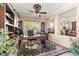 Spacious home office with custom built-ins, comfortable seating, and natural light at 8623 Kennedy Heights Ct, Las Vegas, NV 89131