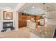 Gourmet kitchen boasts a fireplace, granite counters, and stainless steel appliances at 8623 Kennedy Heights Ct, Las Vegas, NV 89131