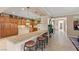The kitchen offers granite countertops, wooden cabinets, and bar stool seating at 8623 Kennedy Heights Ct, Las Vegas, NV 89131