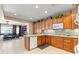 Open concept kitchen with stainless appliances overlooking the living room at 8623 Kennedy Heights Ct, Las Vegas, NV 89131