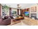 Comfortable living room featuring a fireplace, TV, and plush leather furniture at 8623 Kennedy Heights Ct, Las Vegas, NV 89131