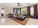 Spacious living area showcases a large window with backyard views and neutral tile flooring at 8623 Kennedy Heights Ct, Las Vegas, NV 89131