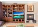 A cozy living room with built-in shelves, fireplace, and decorative accents at 8623 Kennedy Heights Ct, Las Vegas, NV 89131