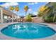 Sparkling pool with lounge chairs and a covered patio, perfect for outdoor relaxation and entertaining at 8623 Kennedy Heights Ct, Las Vegas, NV 89131