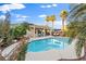 Inviting backyard pool surrounded by lush landscaping and a covered patio for outdoor relaxation at 8623 Kennedy Heights Ct, Las Vegas, NV 89131