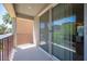 Inviting balcony with metal railing overlooking lush greenery and residential street at 9314 Hopcroft Ave, Las Vegas, NV 89178