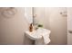 Charming powder room with stylish pedestal sink, modern fixtures, and neutral decor at 9314 Hopcroft Ave, Las Vegas, NV 89178
