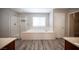 Beautiful bathroom featuring a soaking tub, walk-in shower, and modern finishes at 9314 Hopcroft Ave, Las Vegas, NV 89178