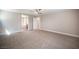 Spacious carpeted bedroom offers ample natural light and a neutral color palette at 9314 Hopcroft Ave, Las Vegas, NV 89178