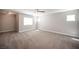 Bright bedroom with large windows, neutral carpeting, and plenty of natural light at 9314 Hopcroft Ave, Las Vegas, NV 89178