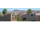 Exterior view of community with desert landscaping and mountain backdrop at 9314 Hopcroft Ave, Las Vegas, NV 89178
