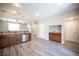 Stylish kitchen area with granite countertops, stainless steel appliances, and adjacent living space at 9314 Hopcroft Ave, Las Vegas, NV 89178
