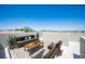 Rooftop terrace with stylish outdoor furniture and panoramic city views on a clear day at 9314 Hopcroft Ave, Las Vegas, NV 89178