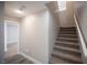 Carpeted staircase leading to the upper level, with fresh paint and modern lighting at 9314 Hopcroft Ave, Las Vegas, NV 89178