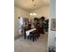 Dining room with elegant chandelier, carpet flooring, dining table and display cabinet at 9505 Quail Ridge Dr, Las Vegas, NV 89134
