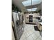 Well-lit kitchen featuring stainless steel appliances and ample cabinet space at 9505 Quail Ridge Dr, Las Vegas, NV 89134