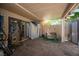 Spacious covered patio featuring paver flooring with a small storage shed for outdoor storage at 9632 Spanish Steps Ln, Las Vegas, NV 89117
