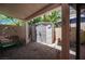 Backyard patio with covered storage and a fenced yard, perfect for outdoor living at 9632 Spanish Steps Ln, Las Vegas, NV 89117