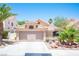 Charming single-story home with a well-manicured front yard, desert landscaping, and a two-car garage at 9632 Spanish Steps Ln, Las Vegas, NV 89117