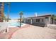 Expansive backyard with a pool, patio area, and desert landscaping at 9728 Drumcannon Ave, Las Vegas, NV 89129