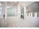 Bright entrance with tile flooring and views into the living room with a fireplace and shuttered windows at 9728 Drumcannon Ave, Las Vegas, NV 89129