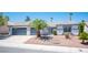 Charming single-story home with a two-car garage and desert landscaping in the front yard at 9728 Drumcannon Ave, Las Vegas, NV 89129