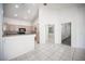 Bright living area with tile floors and an open view to the kitchen and living spaces at 9728 Drumcannon Ave, Las Vegas, NV 89129