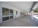 Covered patio with ample space for entertaining and views of the pool at 9728 Drumcannon Ave, Las Vegas, NV 89129